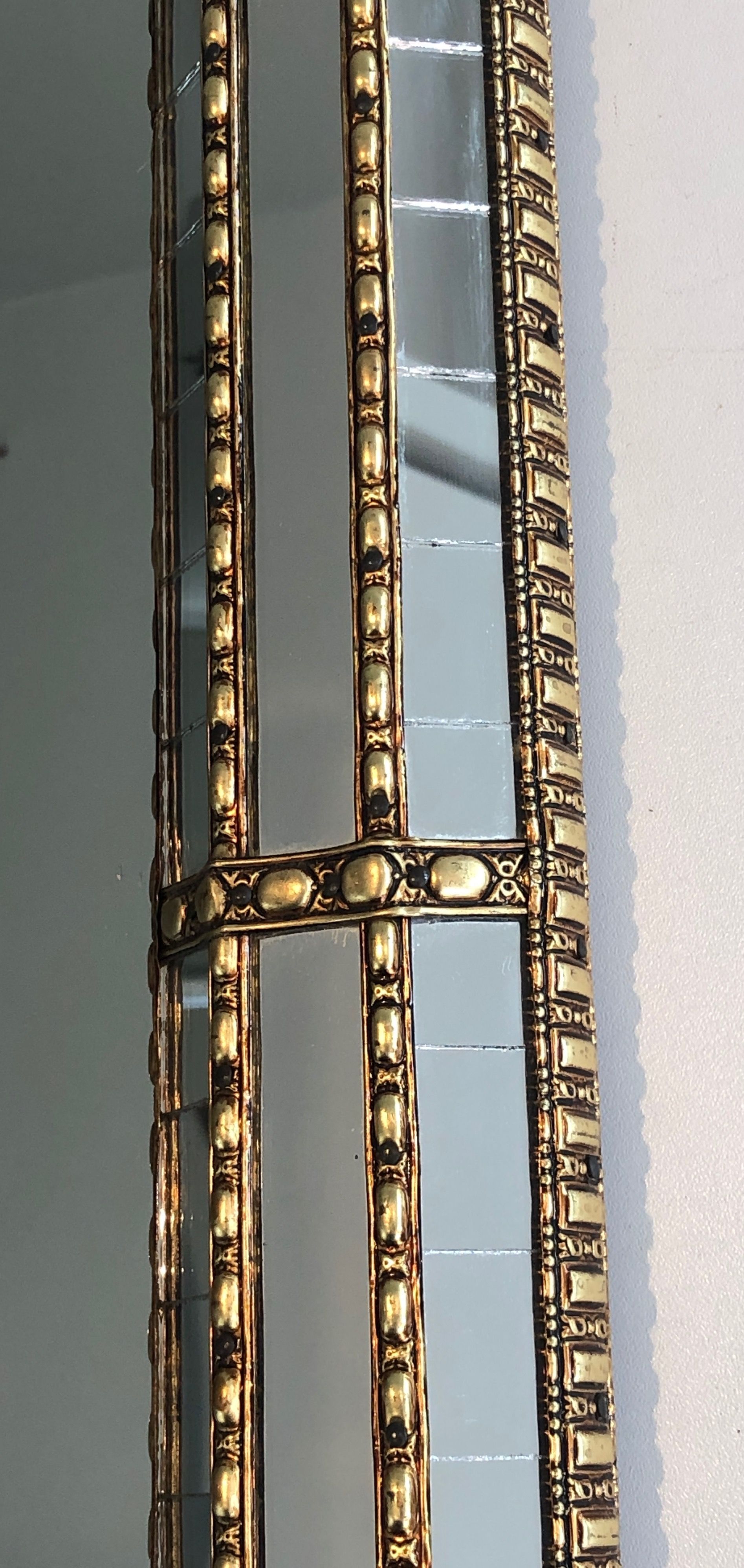 Multi-faceted mirror and brass garlands