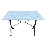 White marble table, cast iron base signed SNES, made in France