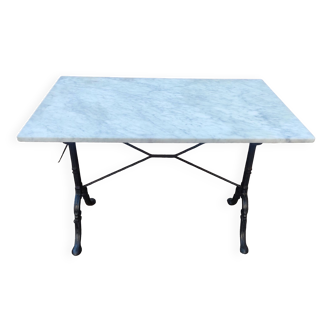 White marble table, cast iron base signed SNES, made in France