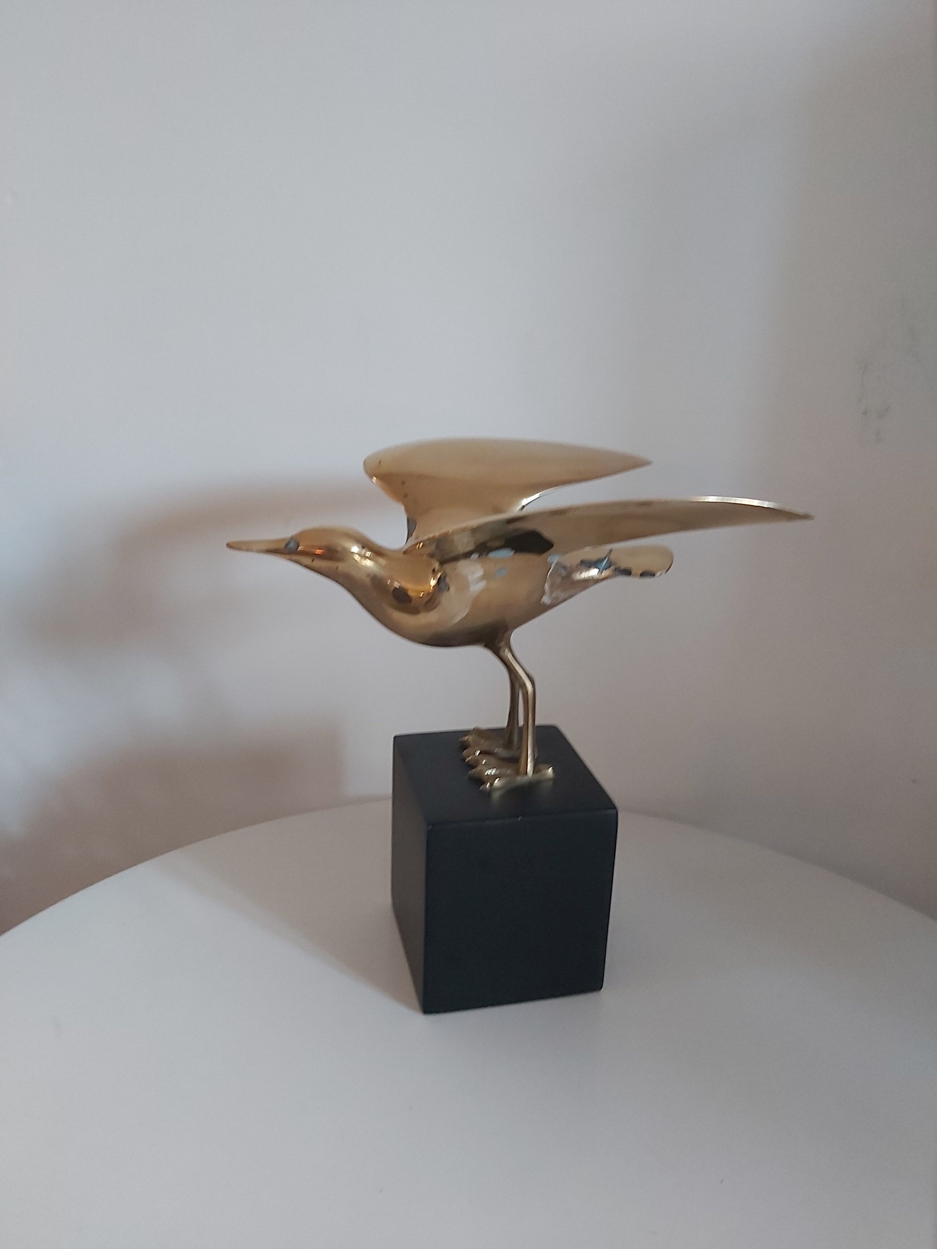 Vintage brass bird on pedestal