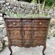 Carved and moulded solid wood commode in the Louis XV style.