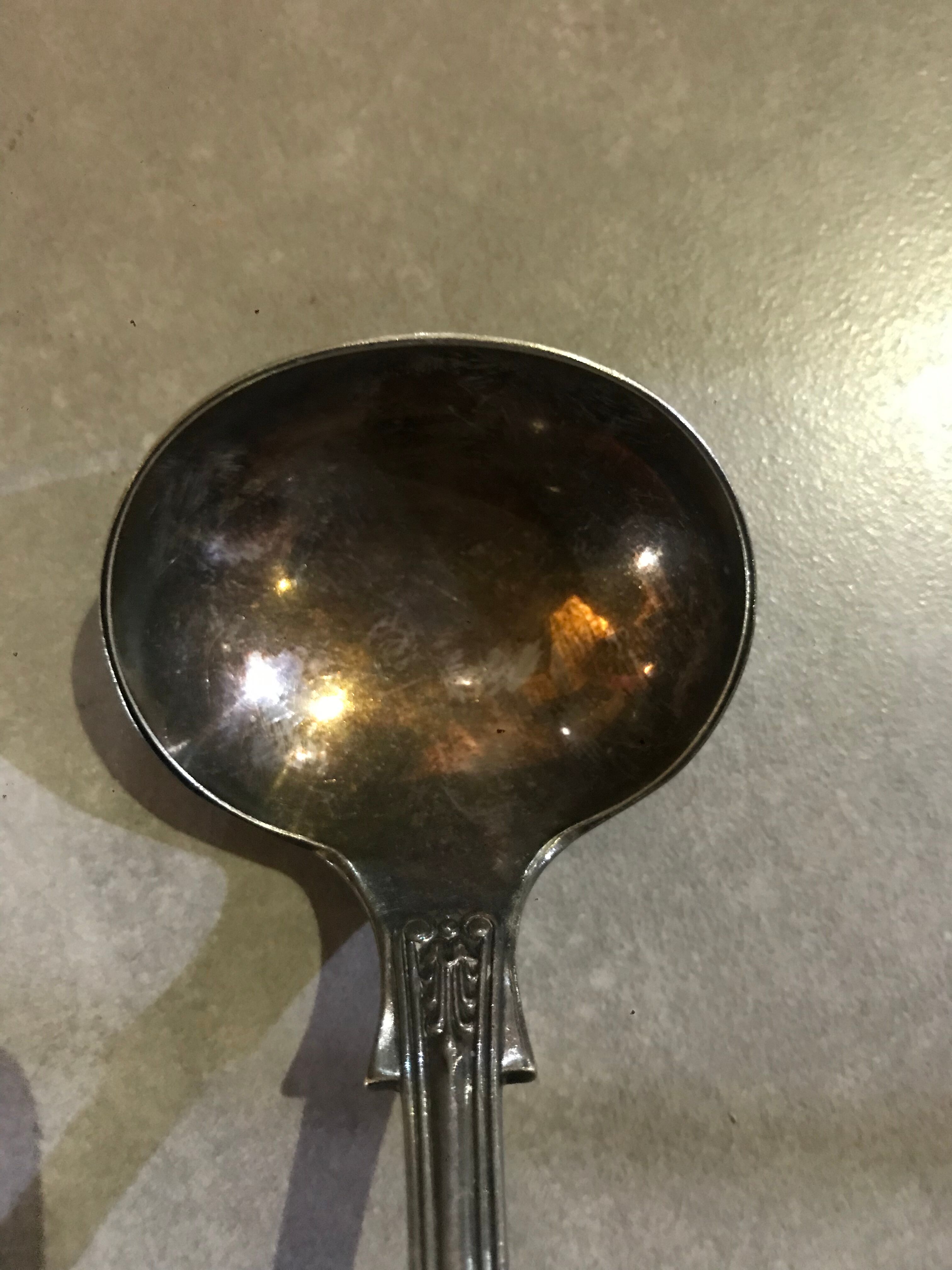 Small silver metal ladle