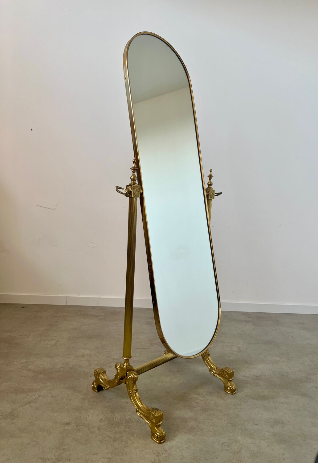 Old free-standing mirror in gilded brass in psychedelic neoclassical style Years 40 France