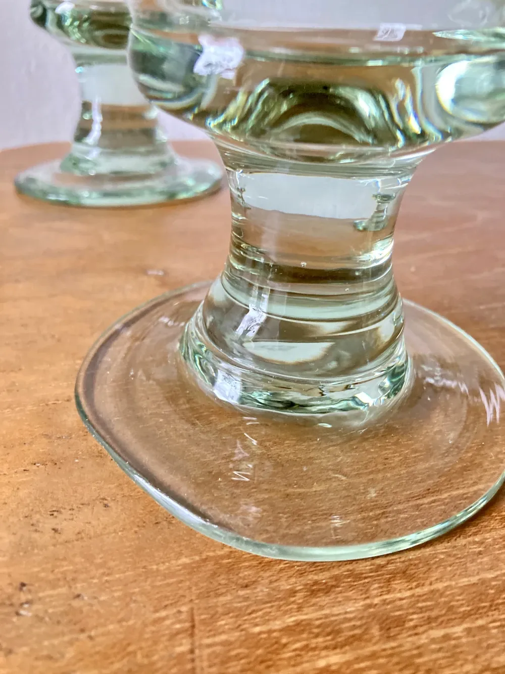 4 stemmed glasses made of handcrafted blown glass in green hue.