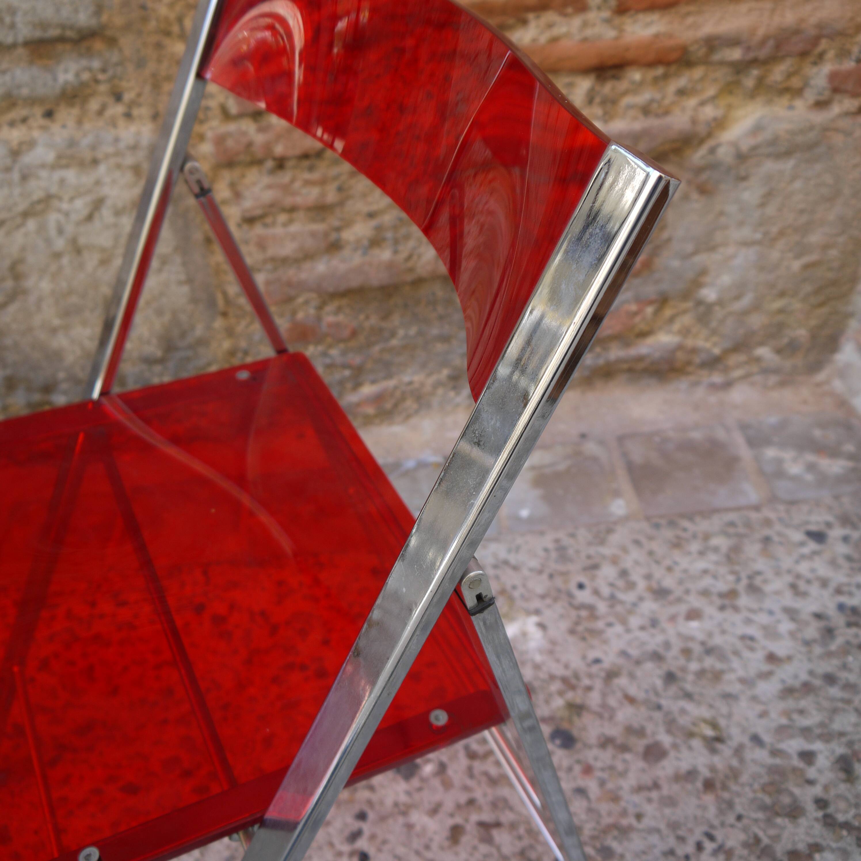 Red Plexiglas folding chair