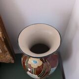 Large vintage antique vase with raised floral pattern.