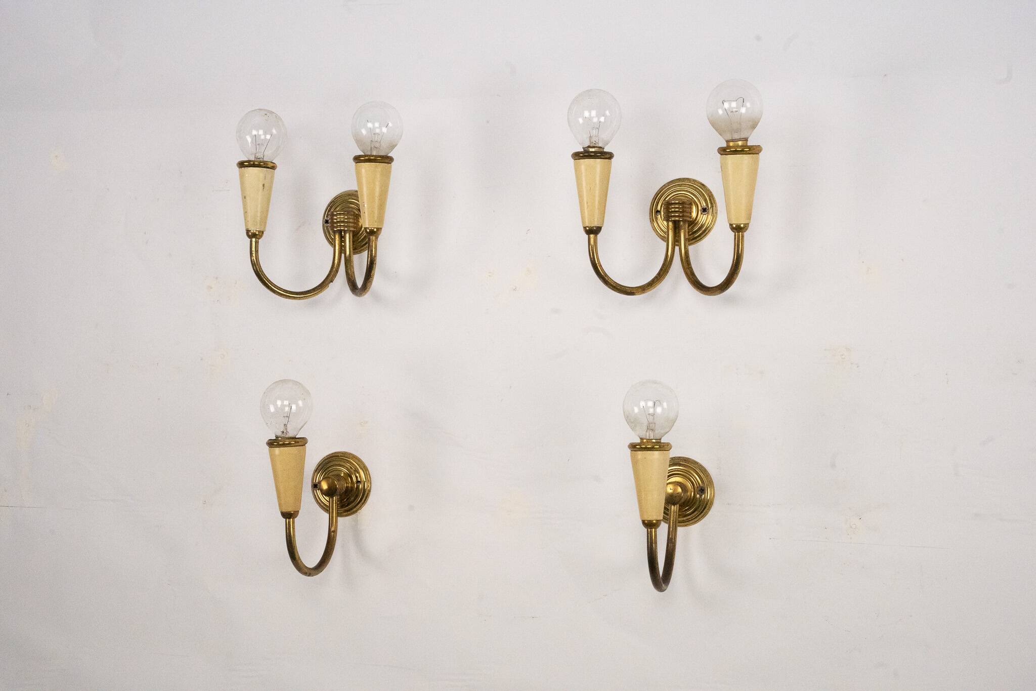Set of four Mid-Century sconces in lacquer and brass. Italy 1950s