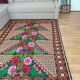Brown wool rug with colorful boho flowers 142x196cm