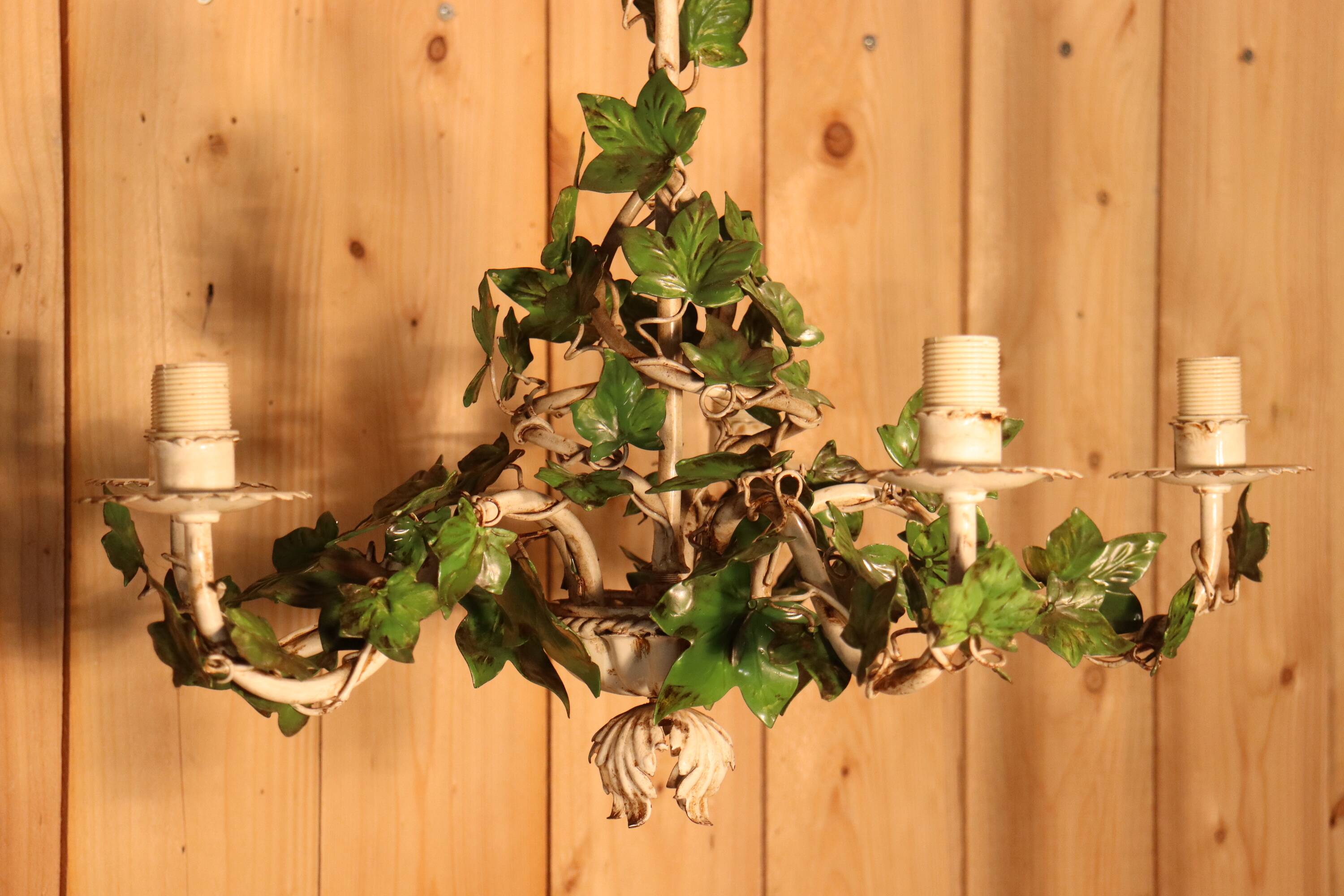 Antique metal chandelier with Art Nouveau floral decoration