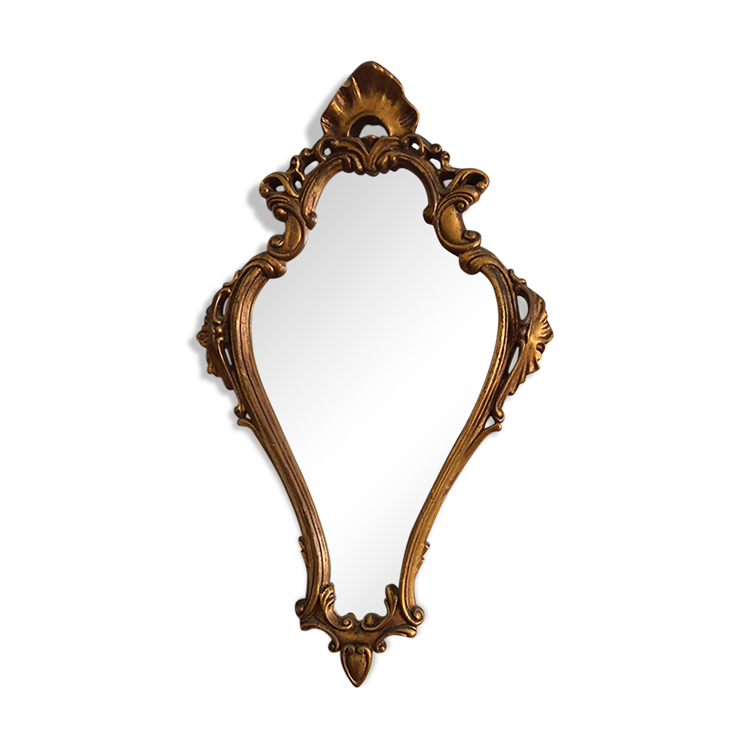 Old wooden mirror and gilded stucco