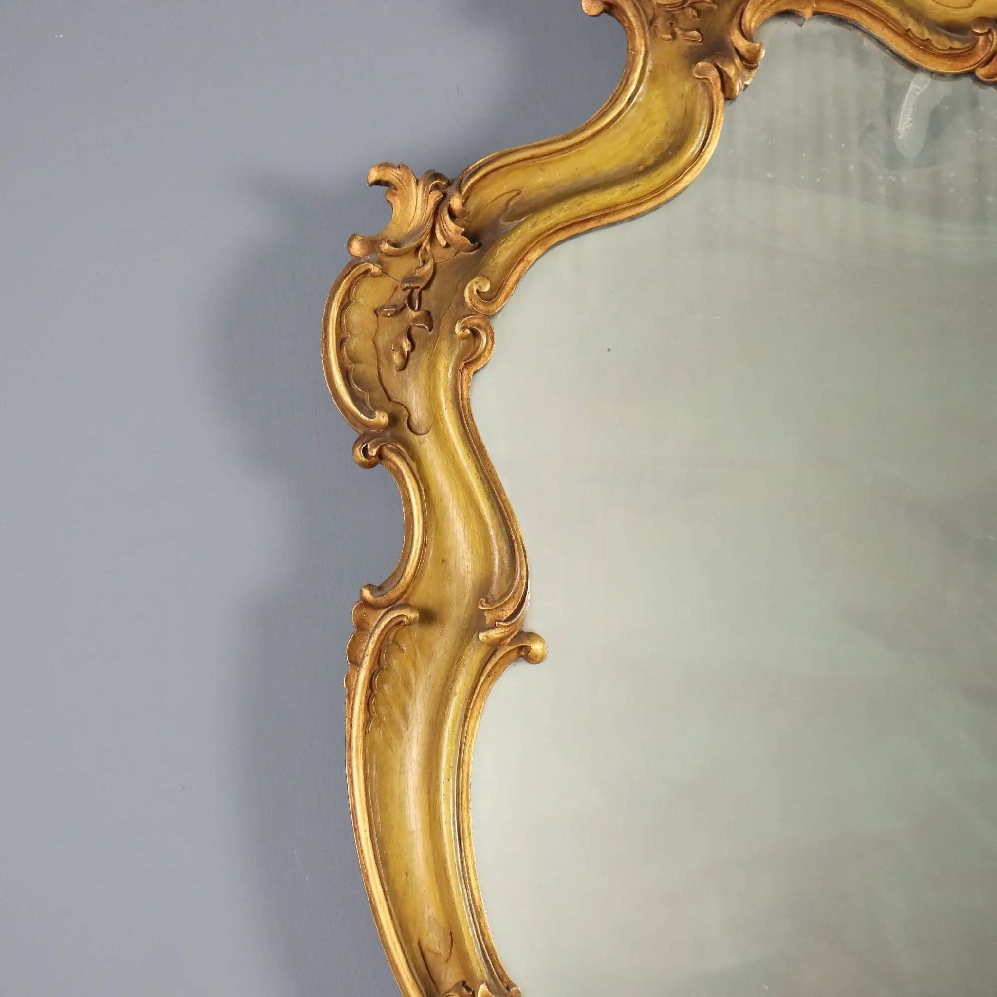 Antique baroque-style mirror in gilded carved wood, Italy 19th century.
