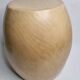 Brutalist monoxyle stool in solid mango wood with an organic shape.