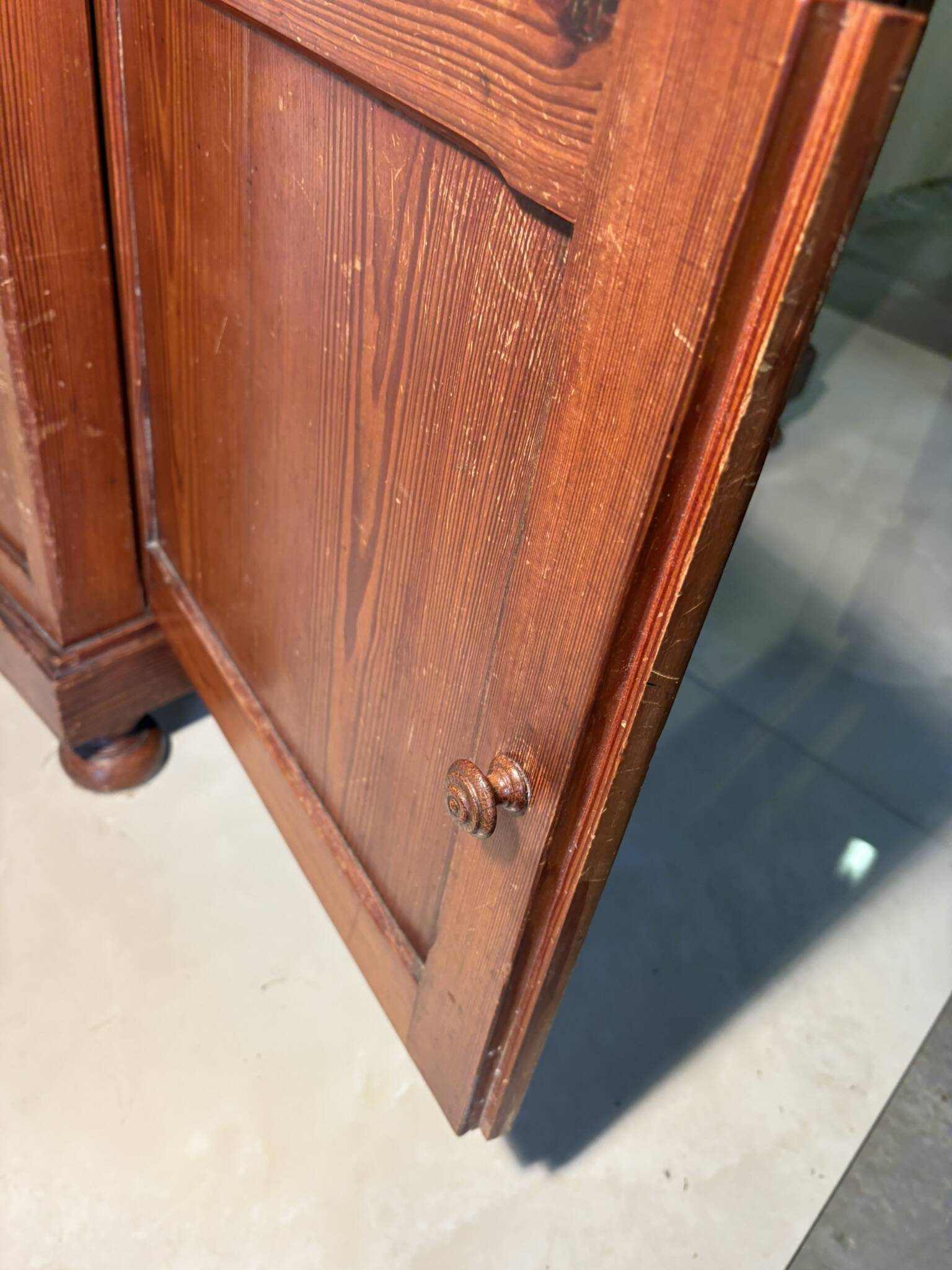 Antique wood and marble kitchen sideboard with carved backsplash