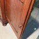 Antique wood and marble kitchen sideboard with carved backsplash