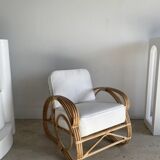 Large rattan rest chair and white cushions