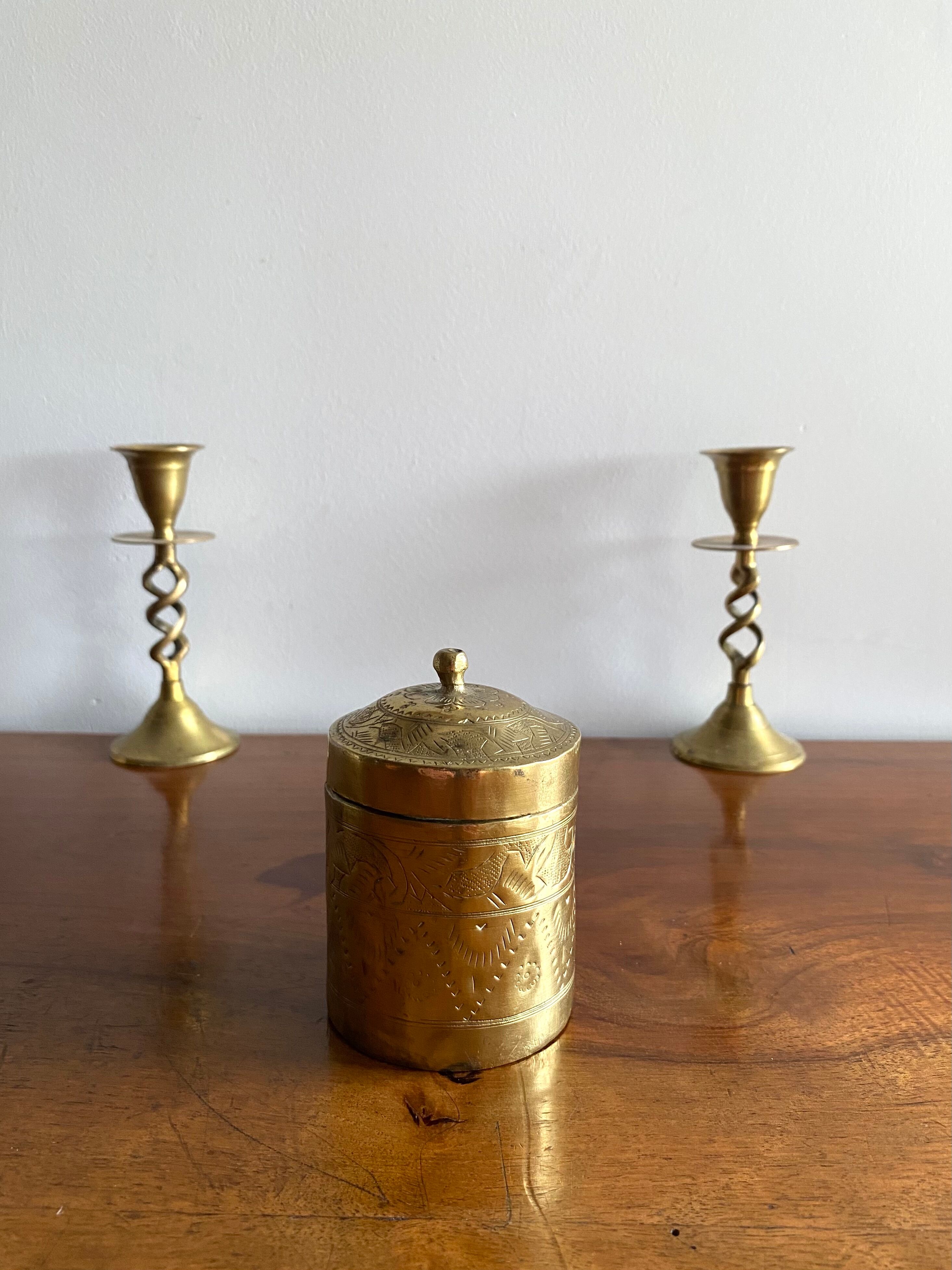 Old round box in chiseled brass