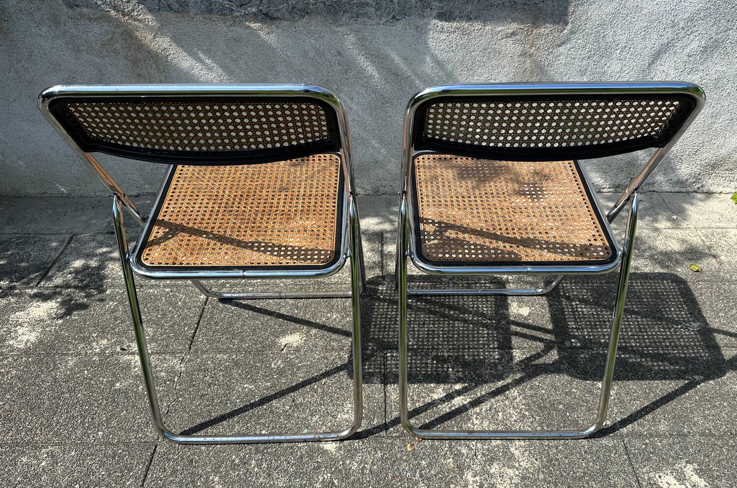 Pair of vintage metal caned folding chairs