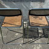 Pair of vintage metal caned folding chairs