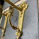 2 brass lion Empire wall sconces