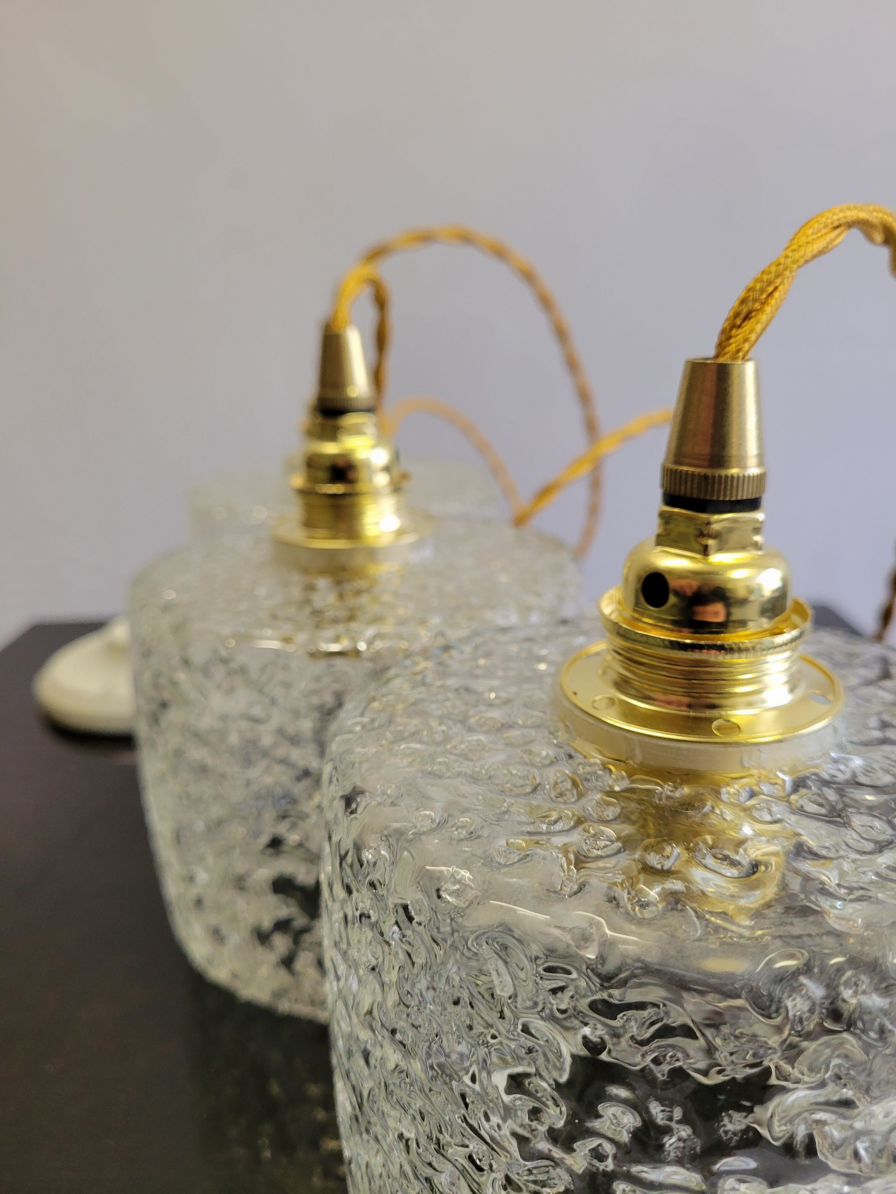 Trio of scrambled glass pendant lamps