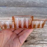 Glass condiment service in transparent pink moulded glass.