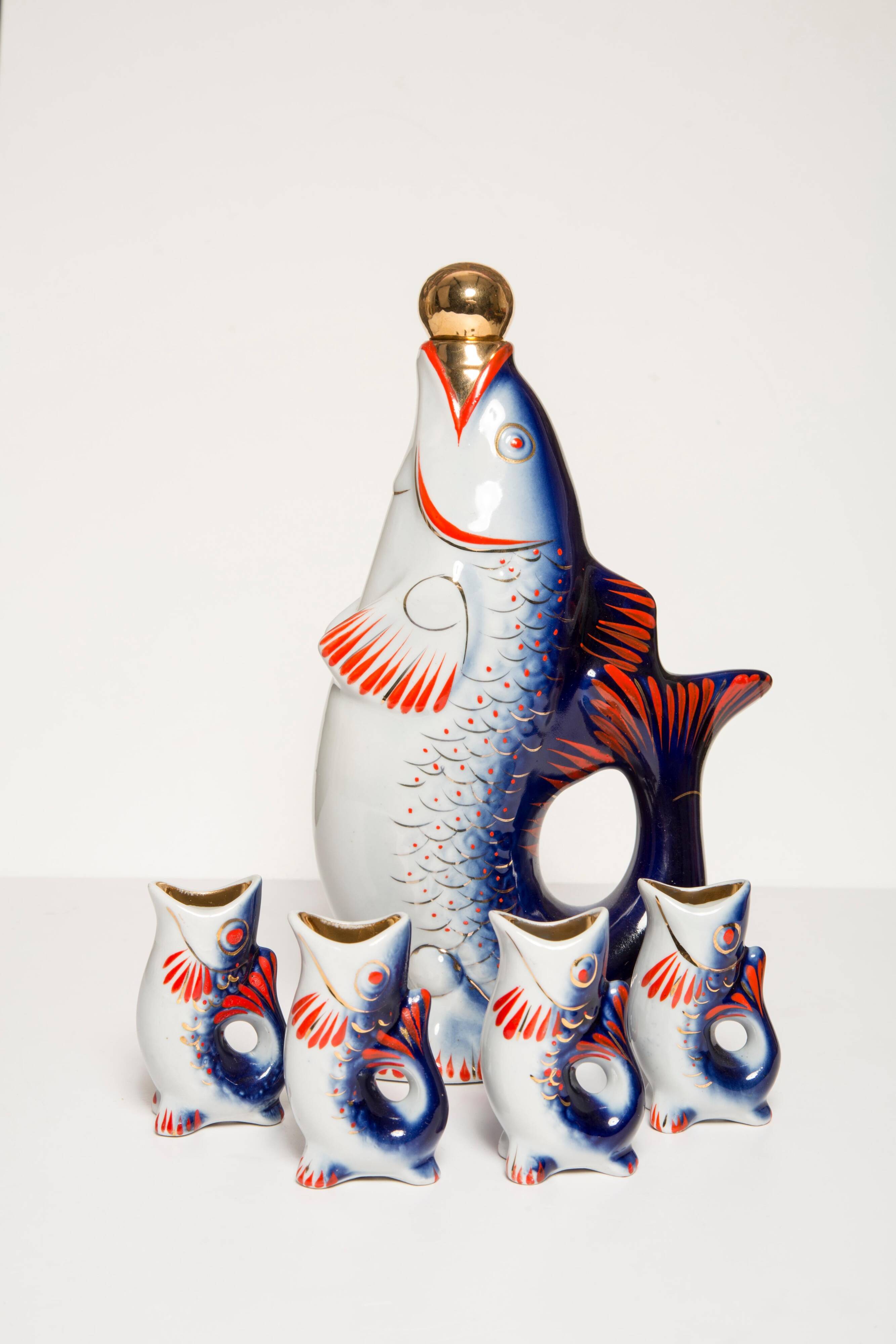 Set of 7 glasses and a glass carafe decorated with blue fish, Mid-Century Modern style, Europe, 1960s.