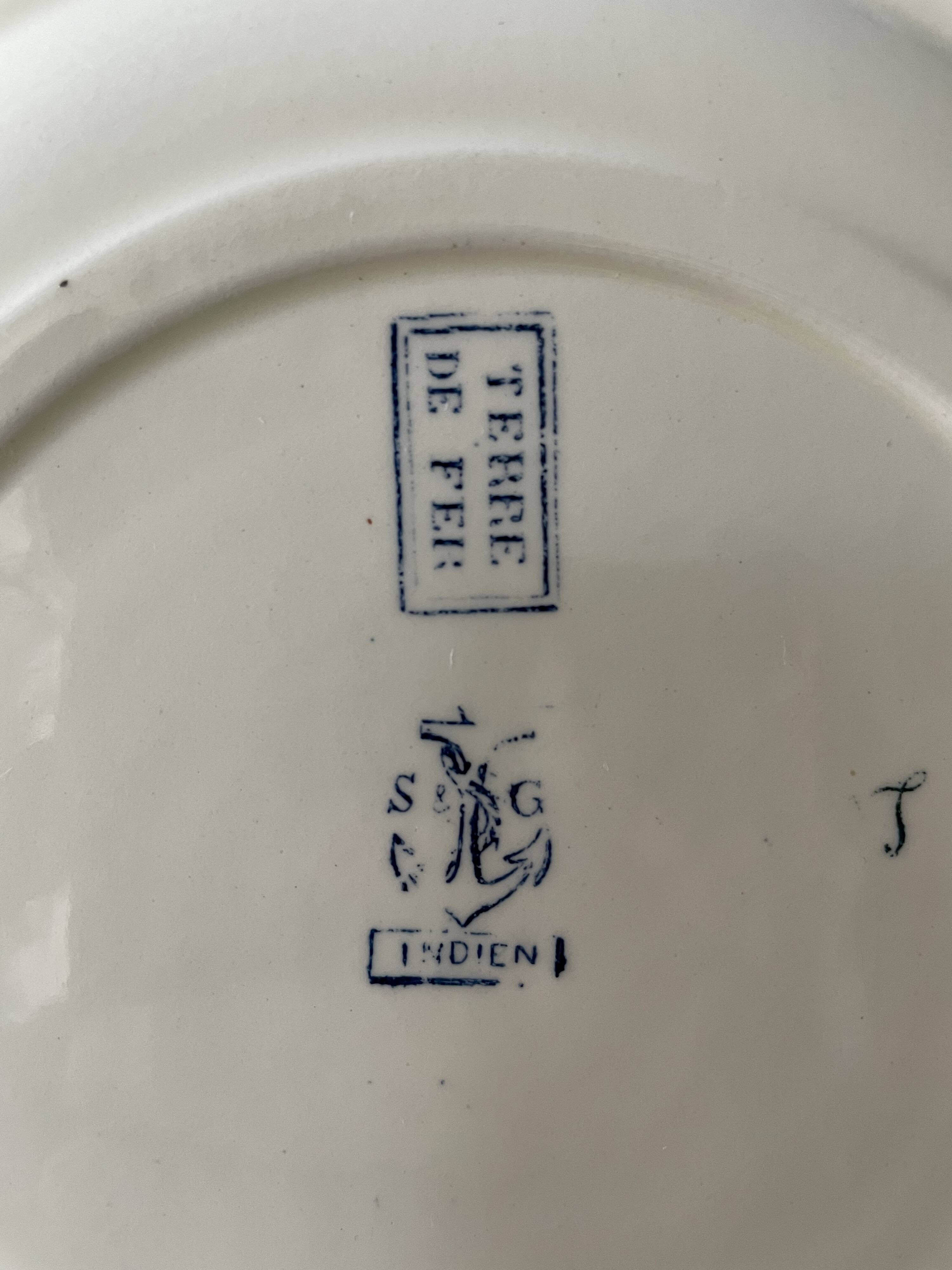 Series of 12 flat plates XIXth earthenware Terre de Fer Clairefontaine