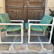 Pair of vintage tubular armchairs from the 70s and 80s, luxury design.