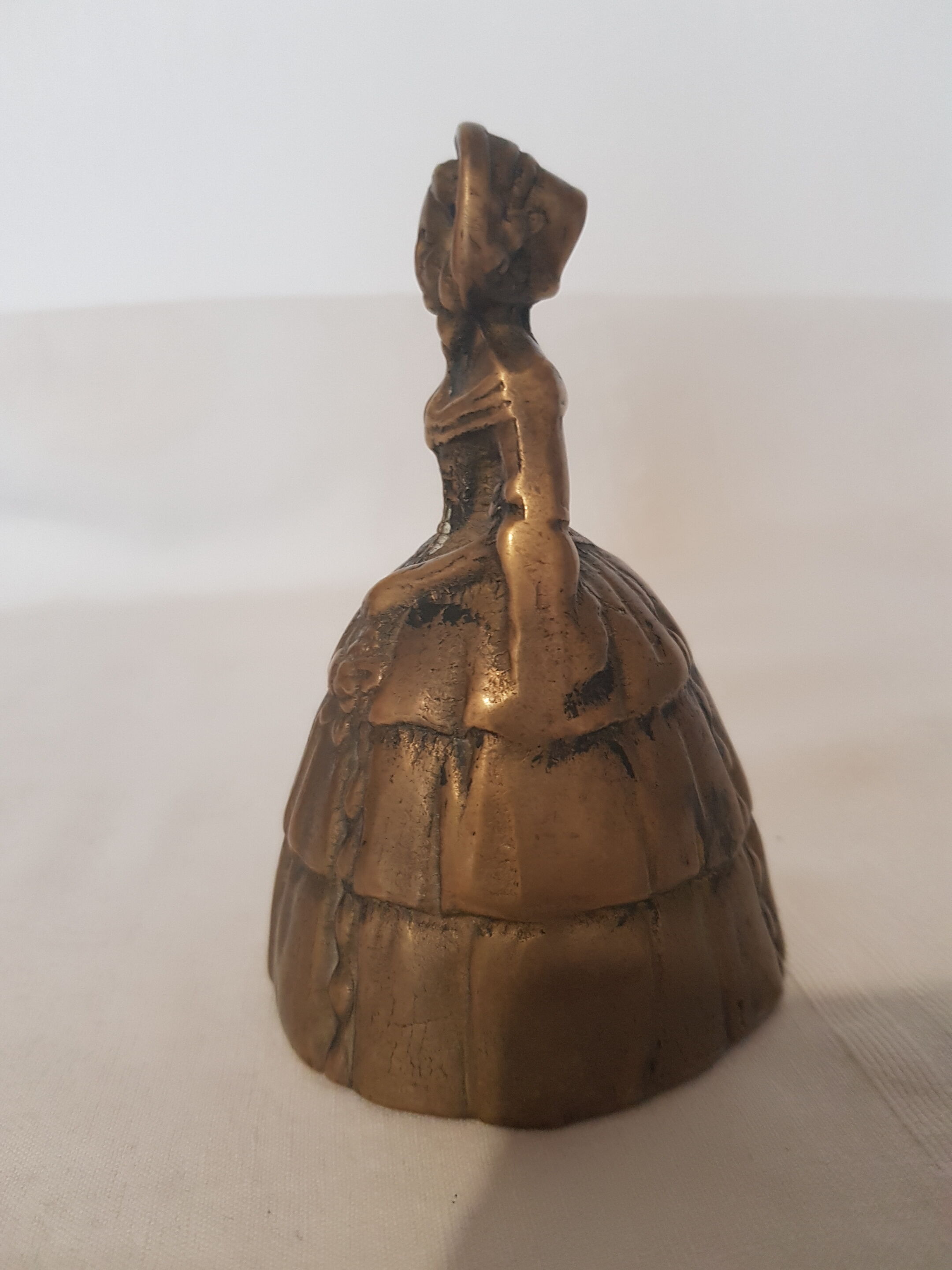 Women's bronze table bell