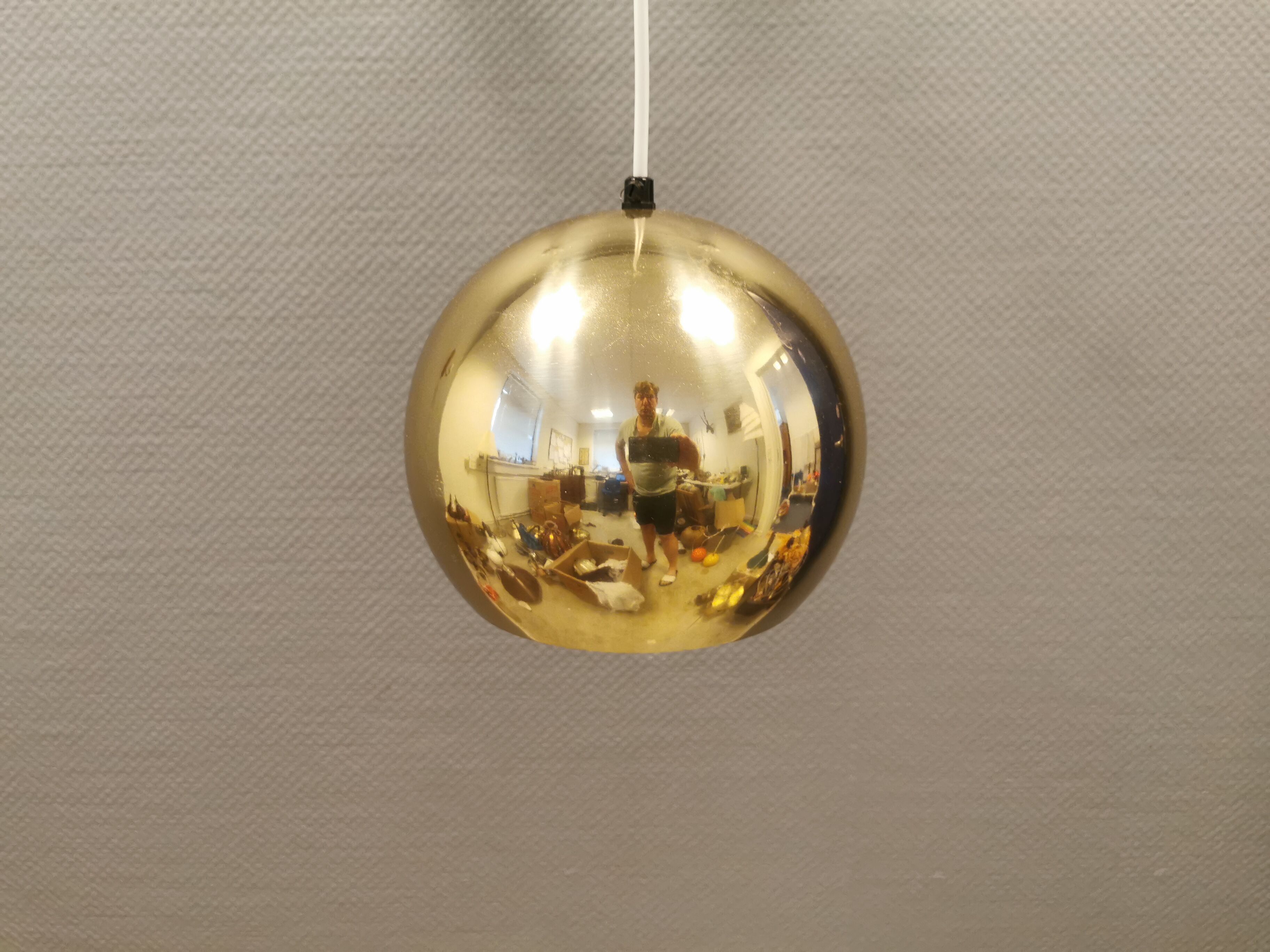 Danish ball lamp from the 80s, in gold colored lacquer.