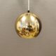 Danish ball lamp from the 80s, in gold colored lacquer.