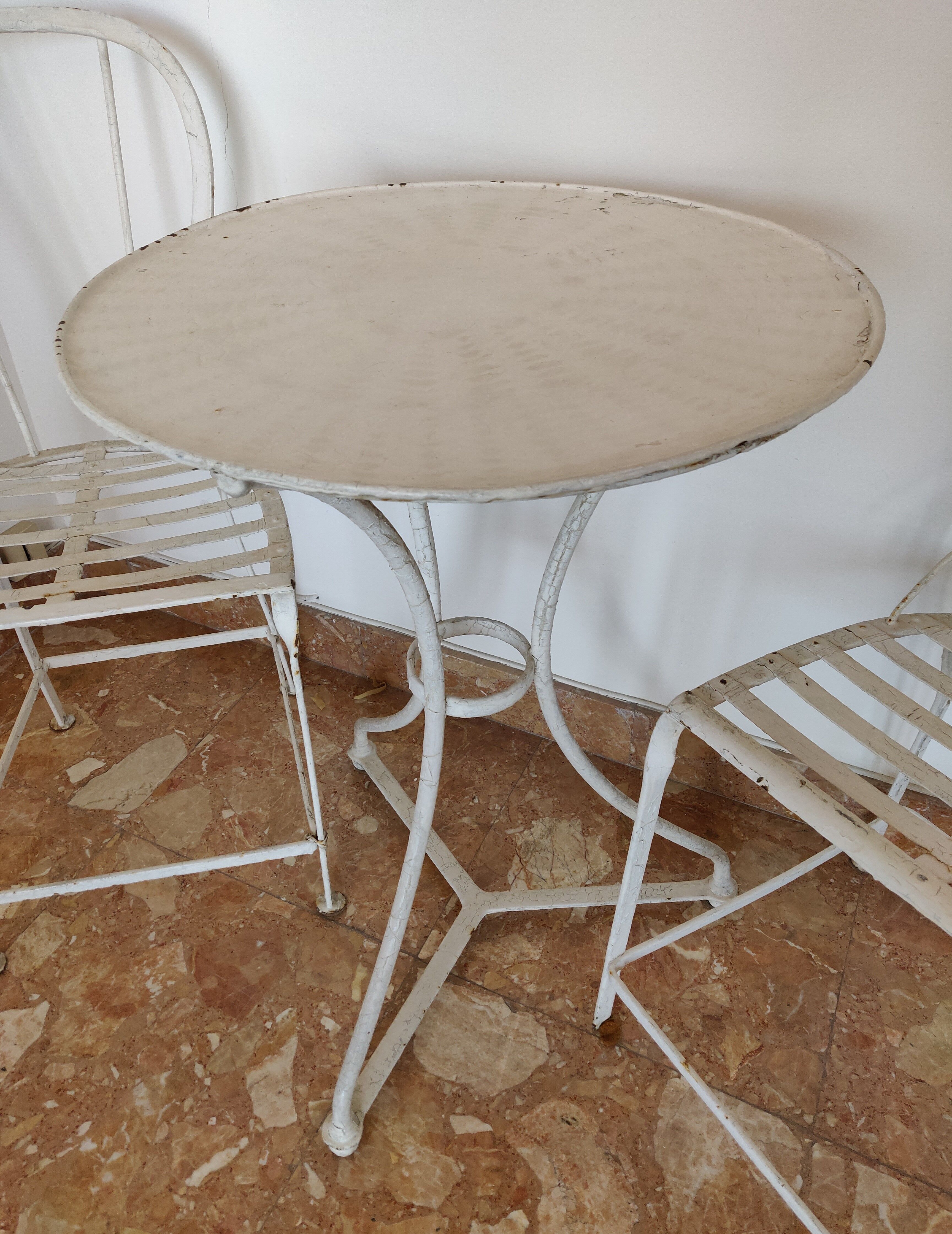 Table and bistro chairs wrought iron terrace