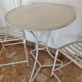 Table and bistro chairs wrought iron terrace