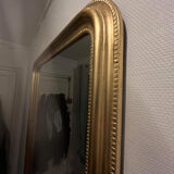 Gilded mirror with moldings