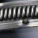 Crystal cup surrounded by two silver friezes