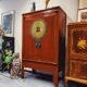 Antique red cabinet with brass details