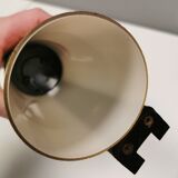 Old wall lamp, made of bakelite with a vanilla/egg colored glass shade.