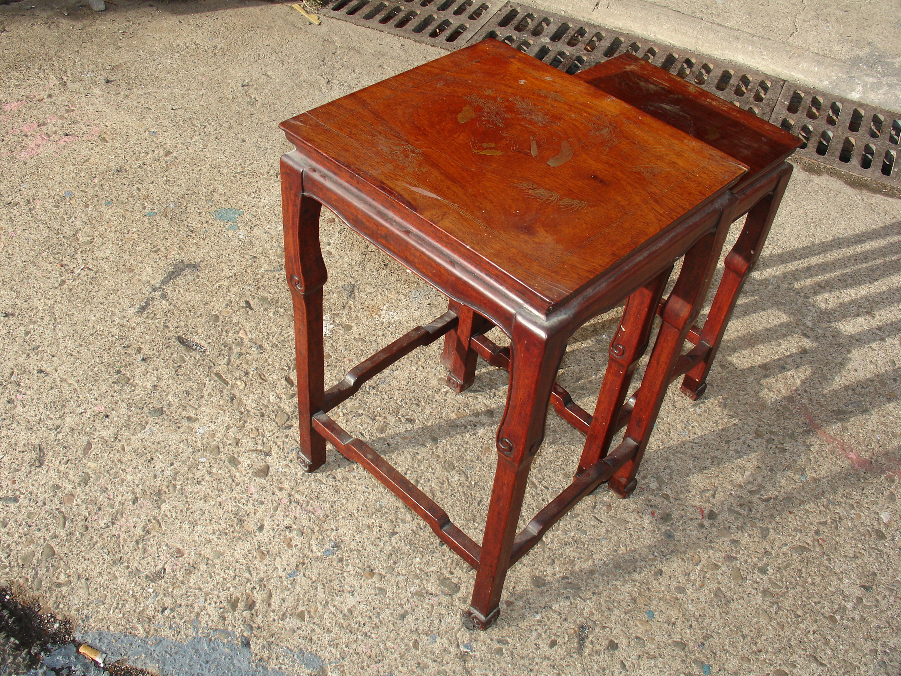 Nesting tables in ironwood with engraved decoration and gold highlights