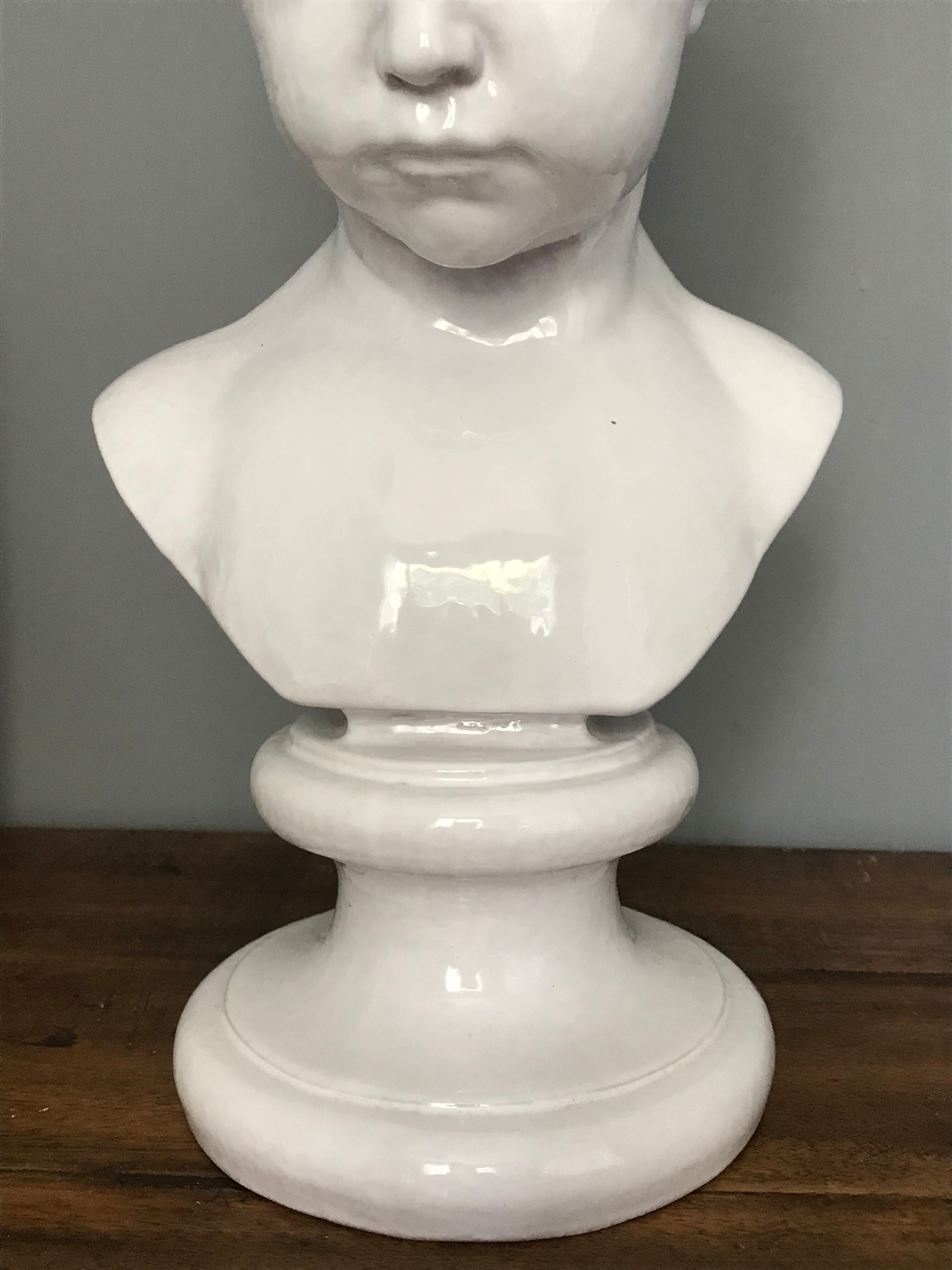 Child bust in enamelled terracotta