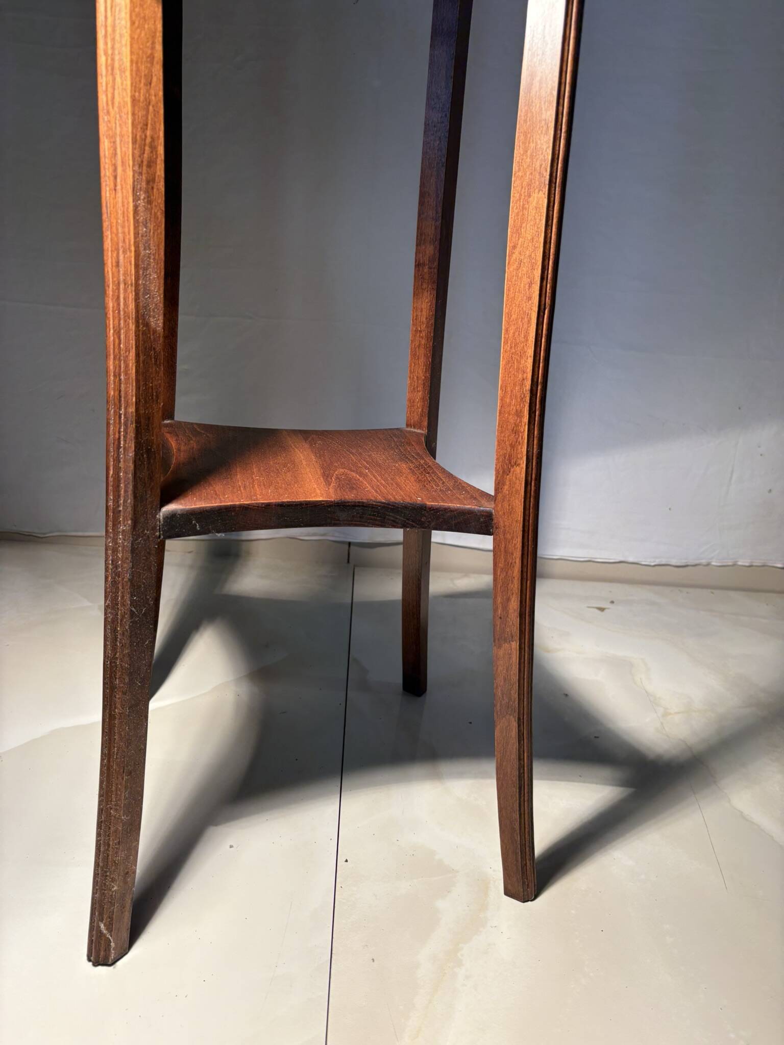 Vintage dark wood side table with curved base
