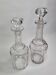 Set of two carved crystal decanters, 24 cm