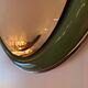 Vintage oval mirror with English green lacquered curved frame and chrome surround