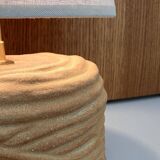 Oval table lamp in handcrafted ceramic with draped effect.