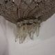 Antique balloon chandelier with pendants, in brass and with mouldings.
