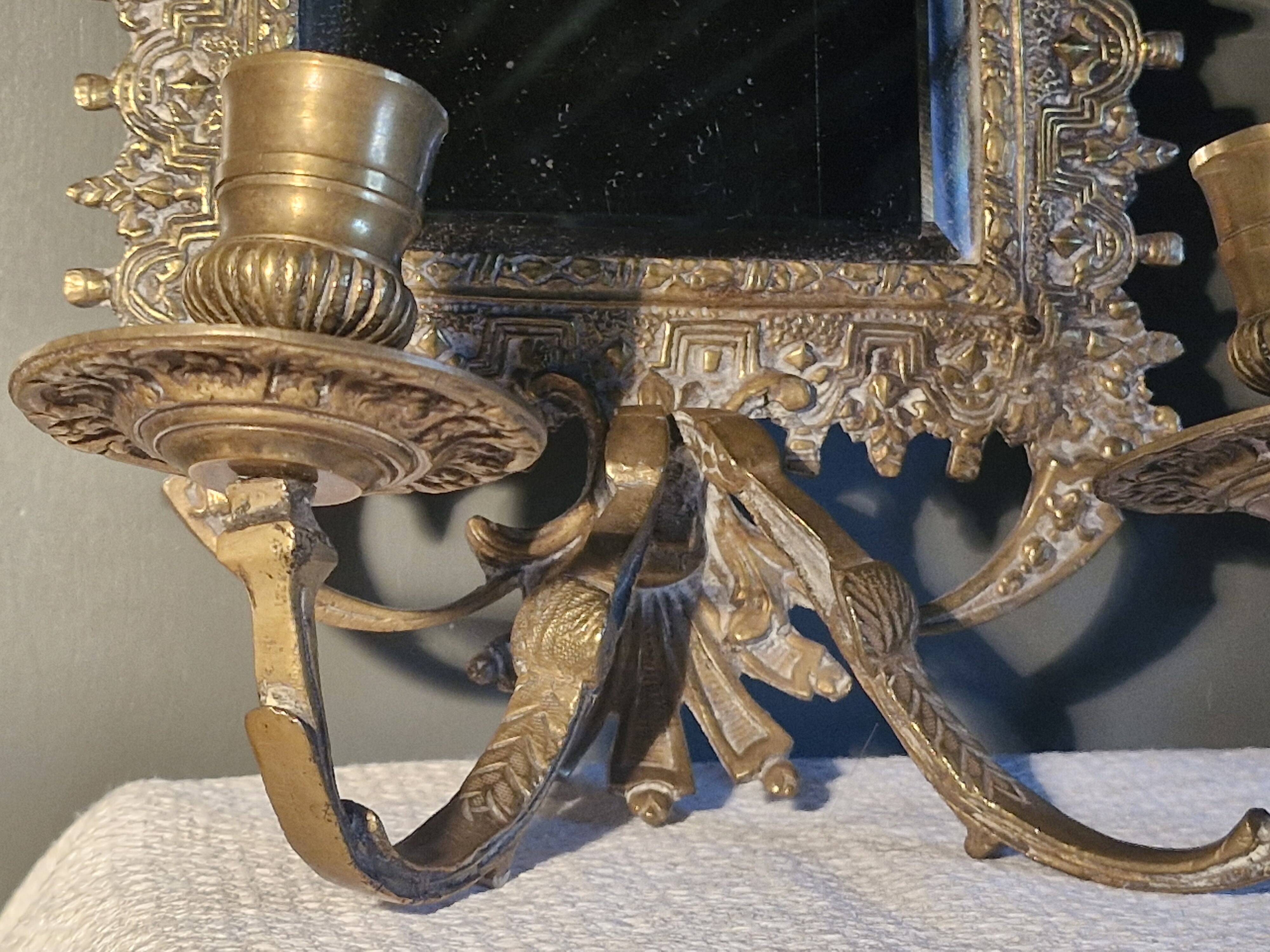 Pair of mirror sconces/candle holders in 19th-century bronze.