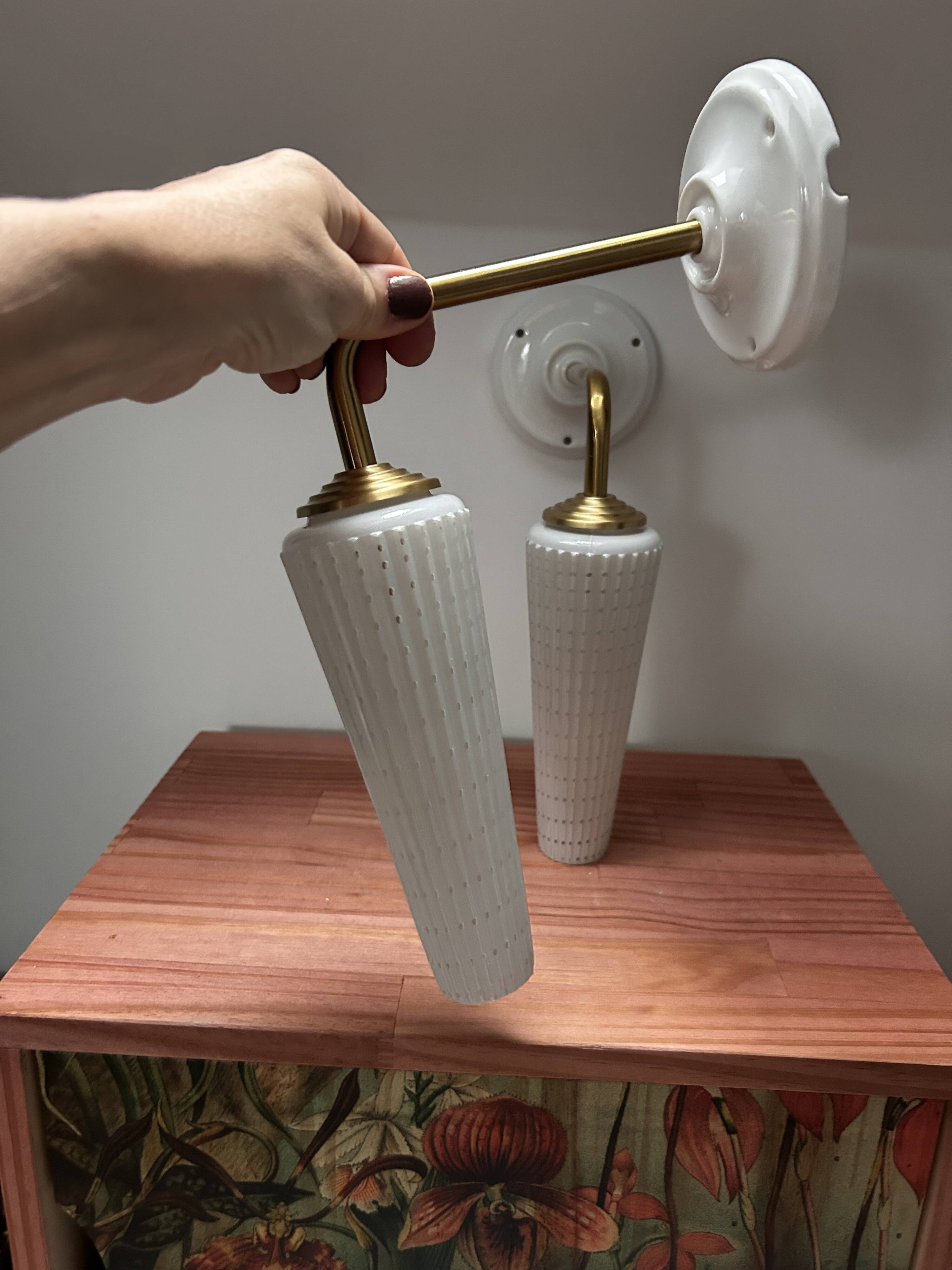 Pair of white and gold wall sconces