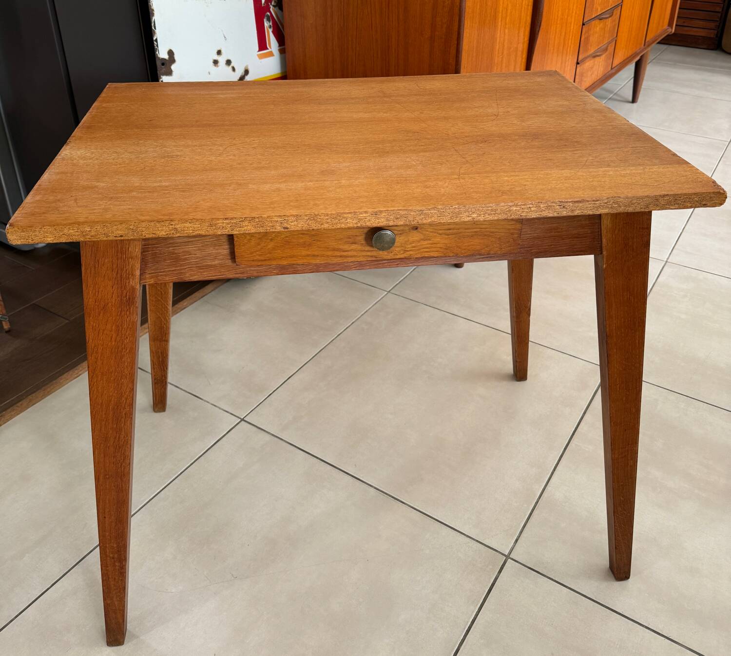 Old wooden desk or side table with compass legs