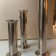 Three silver metal candle holders