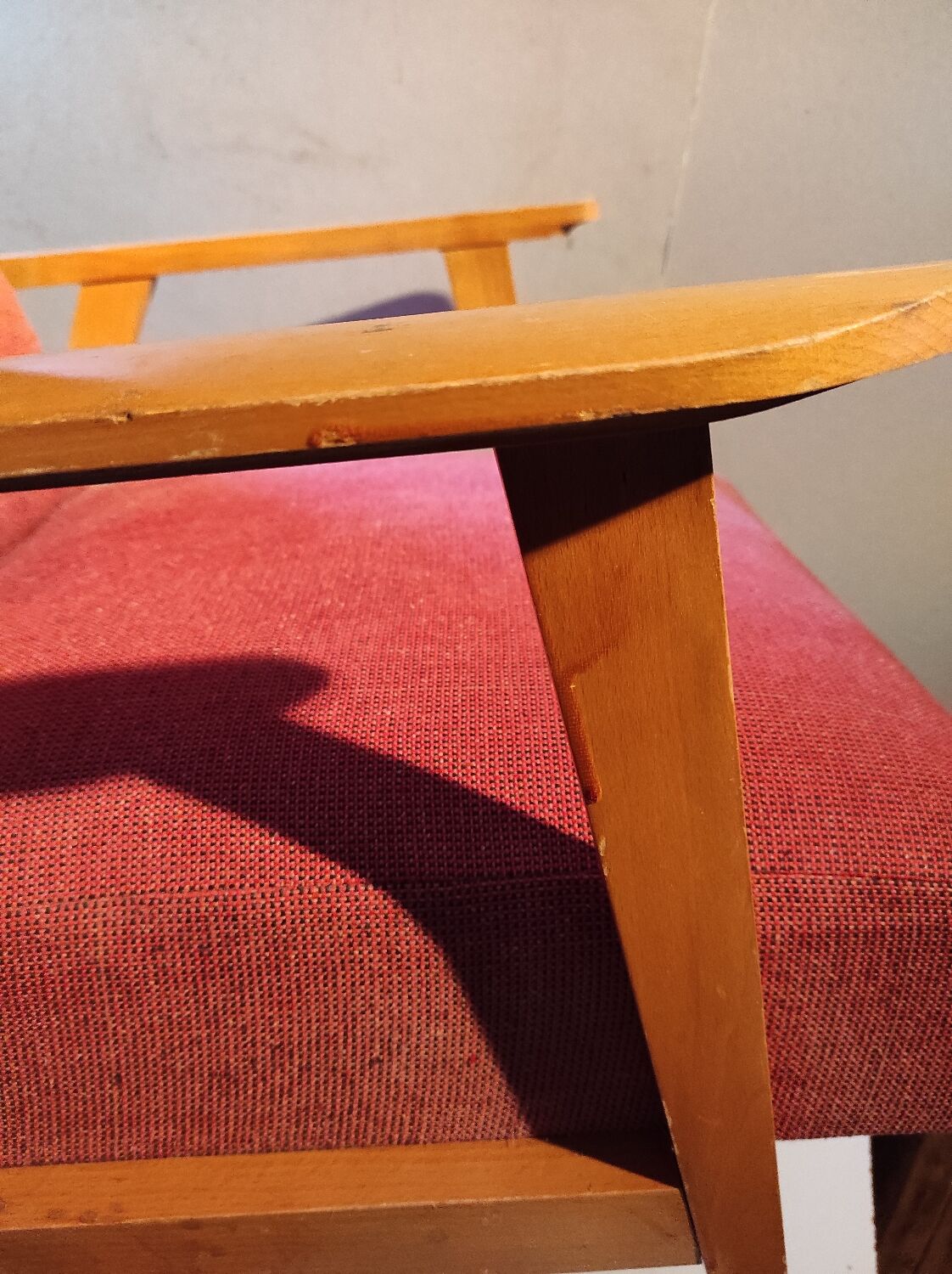 Vintage red armchair with compass feet in Scandinavian design