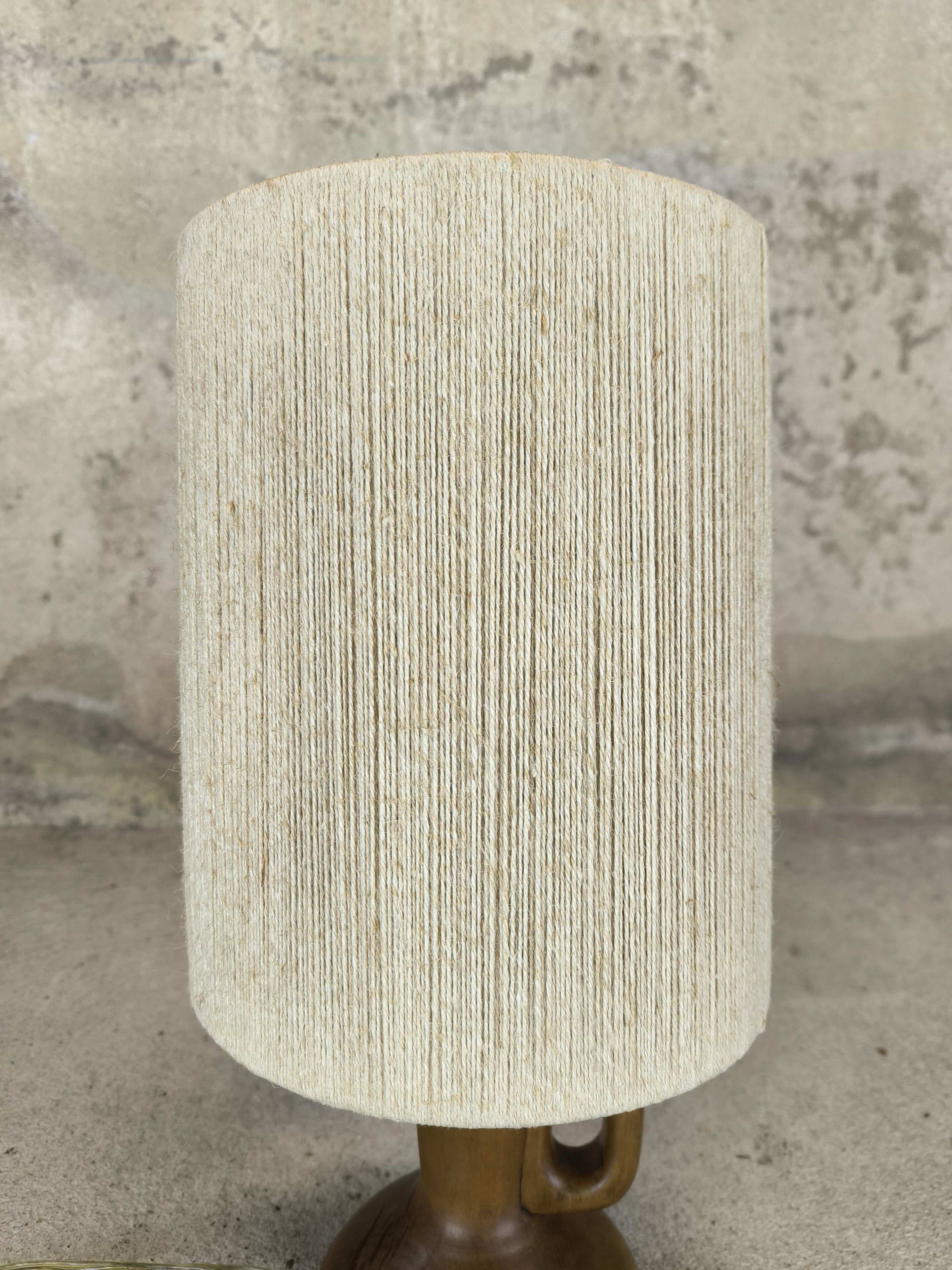 Vintage wooden table lamp with a wool shade.